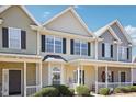 Charming townhouse featuring a cozy front porch, neat landscaping, and a welcoming entrance at 3809 Volkswalk Pl, Raleigh, NC 27610