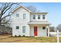 Charming two-story home featuring a bright red front door and modern white siding at 802 Pleasant Dr, Durham, NC 27703