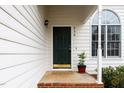 Close-up of the front door featuring brick steps, an arched window, and the house number at 936 Amersham Ln, Wake Forest, NC 27587