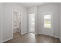 Inviting entryway with modern flooring, showcasing natural light and access to various rooms at 101 Shelfit Trl, Oxford, NC 27565