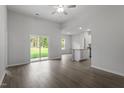 Open-concept living room with sliding glass doors and seamless flow to the kitchen at 101 Shelfit Trl, Oxford, NC 27565