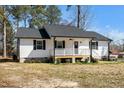 This angle highlights the home's layout, front porch, and easy-to-maintain landscaping at 120 W College St, Oxford, NC 27565