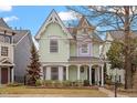 Beautiful two-story home features a welcoming porch with classic columns at 1701 Legendary Ln, Morrisville, NC 27560