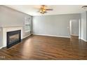 Spacious living room with a fireplace and new laminate flooring, perfect for entertaining at 1756 Main Divide Dr, Wake Forest, NC 27587