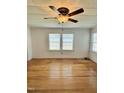 Spacious room with hardwood floors, paneled ceilings, fan and bright natural light at 201 Colonial Ave, Goldston, NC 27252