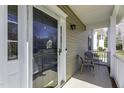 Cozy front porch with seating area perfect for relaxing, featuring white railings and classic details at 2208 Woodbury Dr, Hillsborough, NC 27278