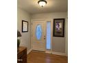 Welcoming entryway with decorative front door and neutral paint at 254 Pedernales Dr, Smithfield, NC 27577