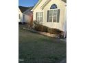 Well-maintained home featuring classic architecture, complemented by a tidy landscaped yard at 254 Pedernales Dr, Smithfield, NC 27577