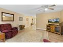 Bright living room featuring a ceiling fan, comfortable seating, and wood-look flooring at 2650 Spring Hill Rd, Spring Hope, NC 27882