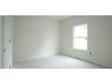 Bright bedroom with a single window and a closet for efficient storage at 303 E C St, Butner, NC 27509