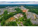 Aerial view of the property near the Safety Center and Costco with surrounding trees at 3132 Fields Dr, Raleigh, NC 27603