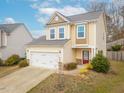 Charming two-story home with a two car garage and a beautifully landscaped front yard at 5315 Glenmorgan Ln, Raleigh, NC 27616