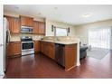 A modern kitchen with stainless steel appliances and granite countertops offers a clean and stylish cooking space at 5315 Glenmorgan Ln, Raleigh, NC 27616