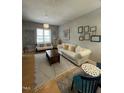Cozy living room with modern decor, hardwood floors, and plenty of natural light at 618 N Boylan Avenue # 300, Raleigh, NC 27603