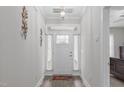 Bright foyer features wood-look flooring and decor at 74 Powderhorn Pt, Garner, NC 27529