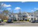 View of well-maintained townhomes, showcasing the community's convenient parking and curb appeal at 8415 Reedy Ridge Ln, Raleigh, NC 27613