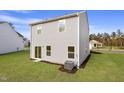 The home has a nice backyard and sliding glass doors, creating an inviting space for outdoor enjoyment at 906 Rhino Bnd, Oxford, NC 27565