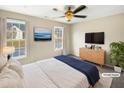 This staged bedroom is bright and airy, with plenty of space and natural light at 910 Savin Lndg, Knightdale, NC 27545