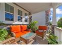 Cozy front porch with wicker furniture, perfect for enjoying sunny afternoons at 1025 Bender Ridge Dr, Morrisville, NC 27560