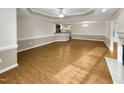 Spacious living room area featuring a fireplace, open floorplan and beautiful wood floors at 12 Stonegate Dr, Angier, NC 27501