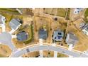 A bird's eye view shows the house with a spacious backyard and a view of the surrounding neighborhood at 1204 Castlestone Ln, Knightdale, NC 27545