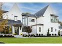 Exterior showing the well-maintained lawn, landscaping, and architectural features at 1421 Sky Vista Way, Raleigh, NC 27613