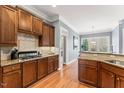 Well-appointed kitchen with wood cabinets, granite counters, and stainless steel appliances at 1425 Princess Anne Rd, Cary, NC 27607