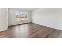 This bedroom features plenty of natural light and neutral finishes at 1426 Cooper St, Sanford, NC 27330