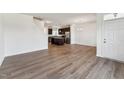 Bright living room featuring modern floors, neutral walls, and an open layout at 1426 Cooper St, Sanford, NC 27330