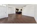Inviting open-concept living area with dark wood floors flowing into modern kitchen at 1432 Cooper St, Sanford, NC 27330