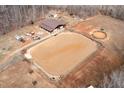 Areal shot of horse property featuring a large riding area and stable at 195 Falcon Ln, Rougemont, NC 27572