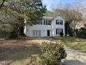 Traditional two-story house with white siding, black shutters, and a driveway leading to the garage at 316 Arbor Greene Dr, Garner, NC 27529