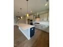 Spacious kitchen with a large island, stainless appliances, and plenty of counter space at 321 Kavanaugh Rd, Wake Forest, NC 27587
