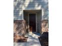 This beautiful front door is framed with brick columns and features sidelight windows at 525 Rockcastle Dr, Cary, NC 27519