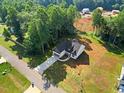 New construction home with a long driveway and a spacious lot surrounded by trees at 5344 Salem Woods Dr # 20, Graham, NC 27253