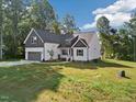 Charming home showcasing a two-car garage and a landscaped yard at 5344 Salem Woods Dr # 20, Graham, NC 27253