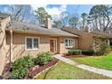 The exterior showcases a well-kept lawn and tidy landscaping around the home at 7914 Yester Ct, Raleigh, NC 27615