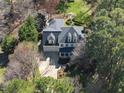An aerial view of a two-story home with dormer windows and attached two car garage at 1006 Henny Pl, Raleigh, NC 27614