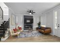 Bright living room boasts a decorative fireplace, stylish furniture, and a neutral color palette at 1105 Massey St, Smithfield, NC 27577