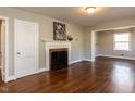 Bright living room with hardwood floors, a decorative fireplace, and an open layout at 1106 Northview St, Garner, NC 27529