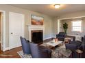 Cozy living room featuring hardwood floors, a fireplace, and comfortable seating area at 1106 Northview St, Garner, NC 27529
