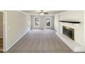 Bright living room featuring fireplace, neutral tones, and ample natural light at 120 Chattleton Ct, Durham, NC 27712