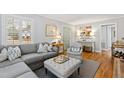 Comfortable living room with a gray sofa set, stylish decor, and ample natural light at 1817 Rankin St, Raleigh, NC 27604