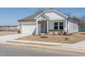 Single Gathering home with brick and siding exterior and attached two car garage on small lot at 185 White Birch Ln, Angier, NC 27501