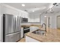 Updated kitchen with stainless steel appliances and granite countertops at 222 Glenwood Avenue # 218, Raleigh, NC 27603