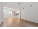 Spacious living area with wood floors and access to the kitchen and door at 222 Glenwood Avenue # 218, Raleigh, NC 27603