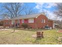 A lovely single story brick home with mature trees and established landscaping at 2503 Mckinney St, Burlington, NC 27217