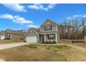 Cozy two-story home with a two-car garage and well-kept lawn and landscaping at 2728 Spring Valley Dr, Creedmoor, NC 27522