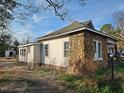Exterior showing a house with stone and siding, plus a chimney and shed at 306 Martin Luther King Jr Dr, Smithfield, NC 27577