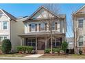 Charming two-story home with a brick facade, inviting front porch, and well-manicured landscaping at 4108 Overcup Oak Ln, Cary, NC 27519